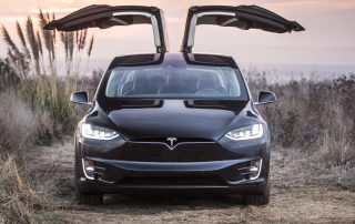 Tesla Boosts Car Production with Humans; Promotes Model X